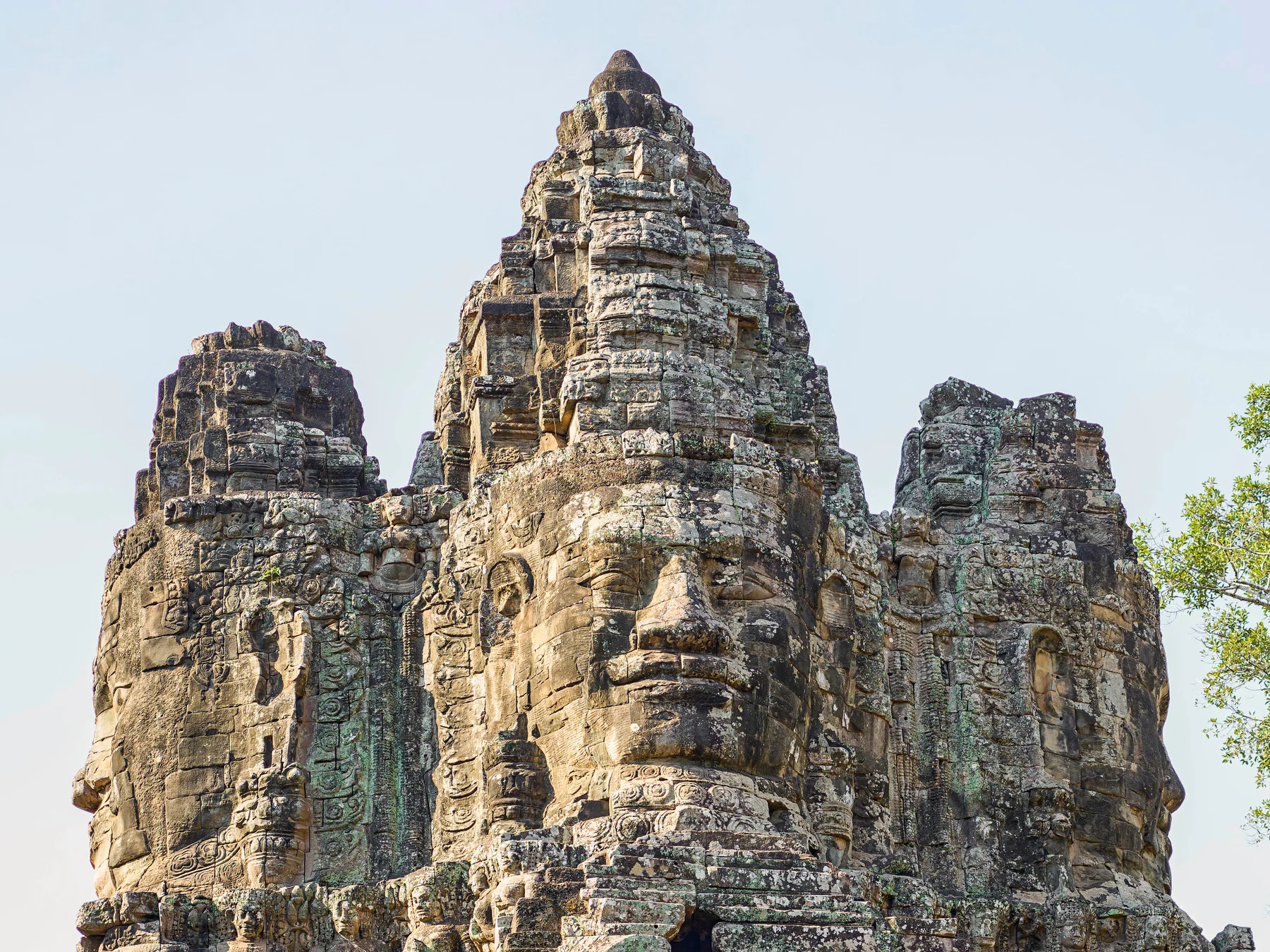 Stone faces carved into a tower at Bayon temple